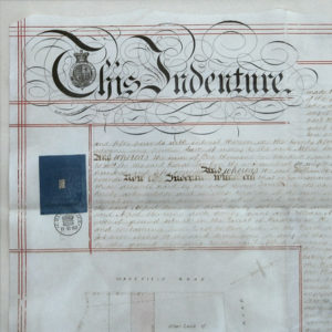 Close up view of a legal document showing a real estate transaction