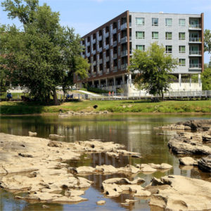 Daytime view of the Riverfront Condominiums in Vermont as seen from the river