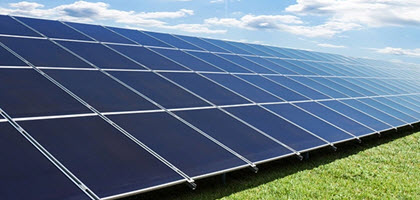 Daytime close up view of solar panels in a solar farm